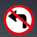 R209 Left Turn Ahead Prohibited Sign