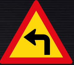TW205 Sharp Curve Left Sign – Temporary