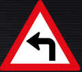 W205 Sharp Curve Left Sign