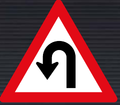 W207 Hairpin Bend Left Sign